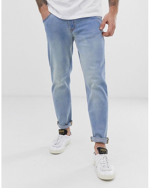 Asos Design recycled tapered jeans in light wash