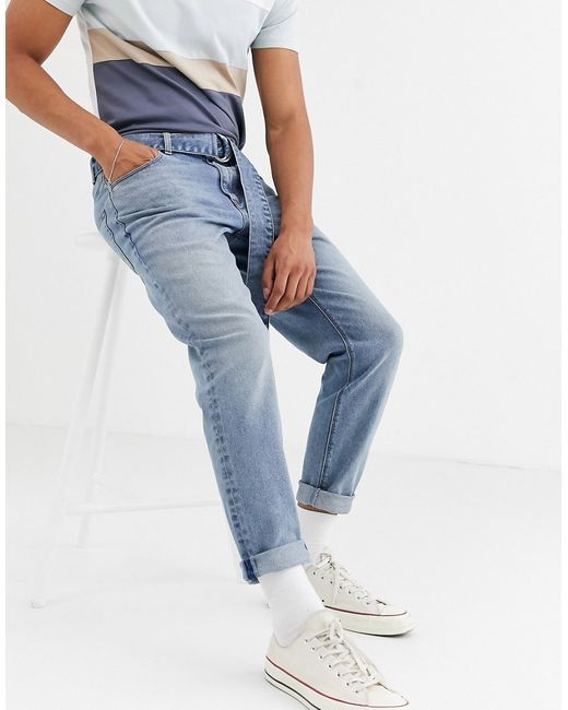 Asos Design tapered jeans in vintage mid wash with self