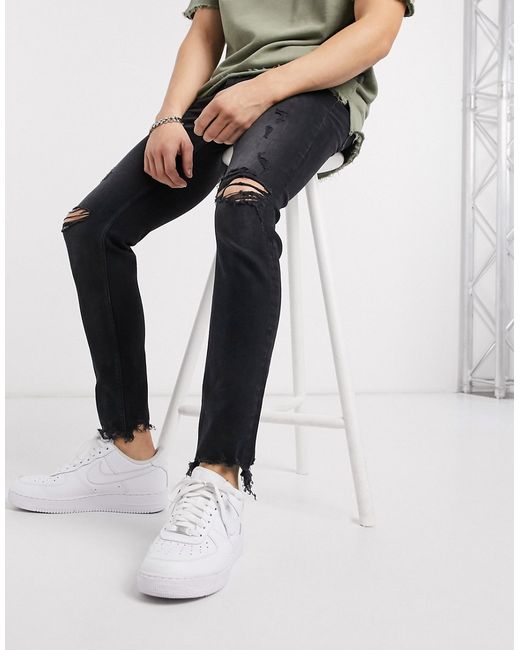 Bershka skinny jeans in washed with rips