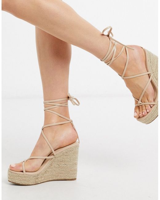 Glamorous espadrille wedge sandal with ankle tie in