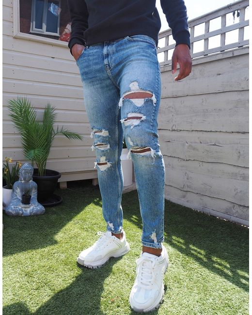Bershka super skinny jeans with rips in