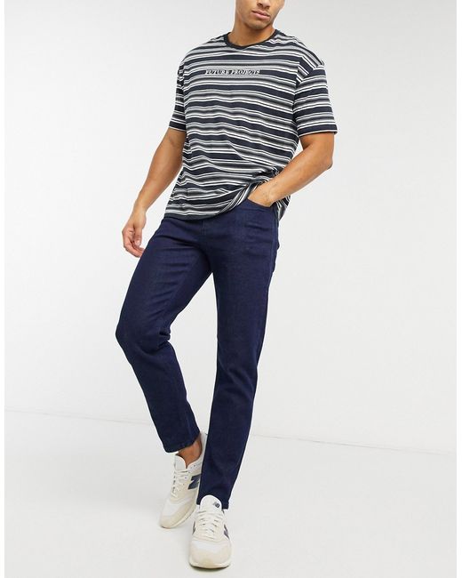 Asos Design tapered jeans in indigo-