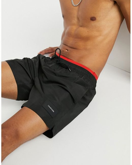 Calvin Klein medium length swim shorts with double waistband in