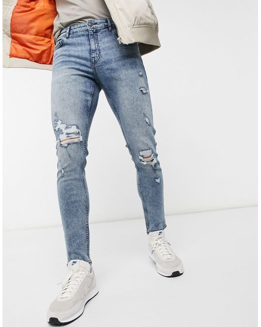 New Look skinny jeans with rips in mid blue wash-