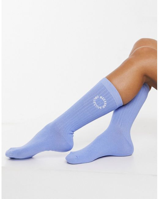 ASOS Weekend Collective calf length ribbed socks with embroidered logo in blue-