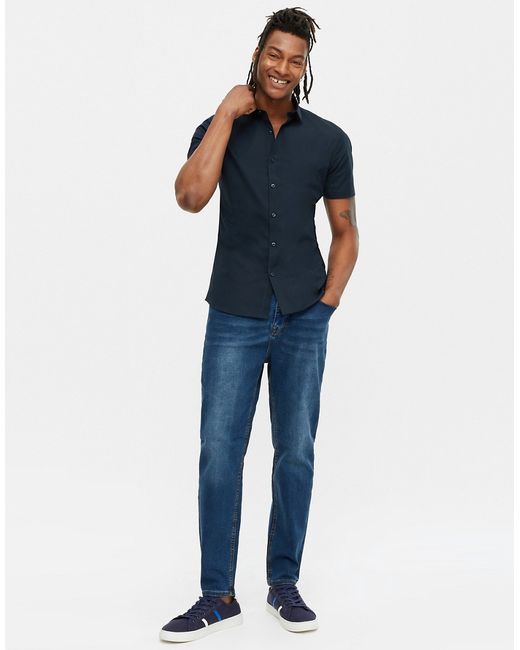 New Look tapered jeans in mid wash-