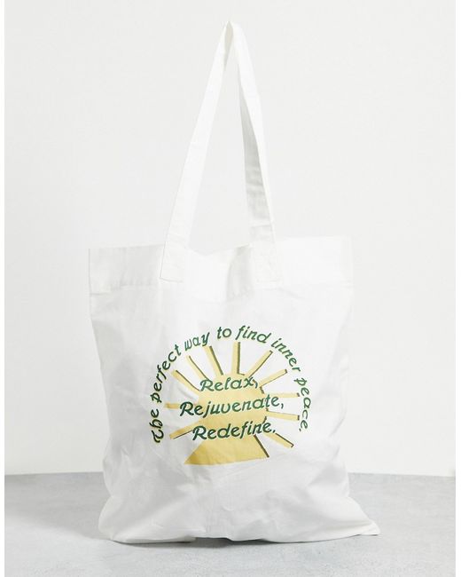 Asos Design organic tote bag in natural with relax print-