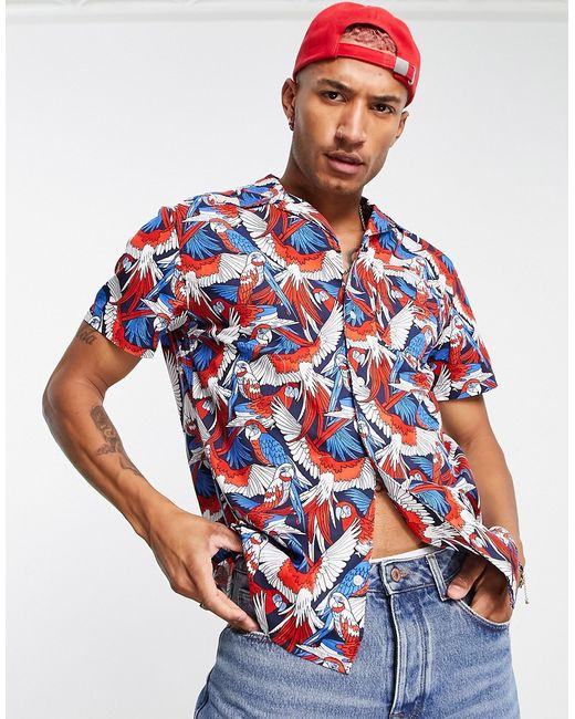 Tommy Jeans all over parrot print short sleeve camp shirt in