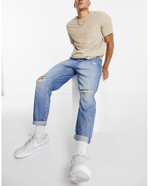 Topman ripped relaxed jeans in mid wash-