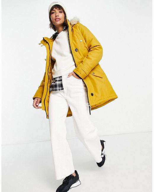 Vero Moda parka with faux fur lined hood In yellow-