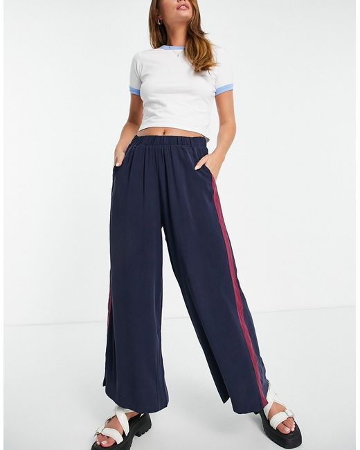Native Youth wide leg pants in navy with side stripe and snap detail-