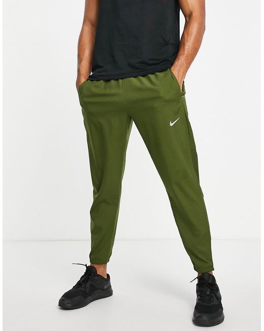 Nike Running Dri-FIT Challenger woven pants in khaki-