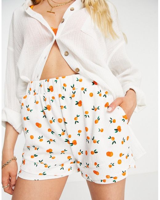 Vero Moda high waisted pull on shorts in white fruit print part of a set-