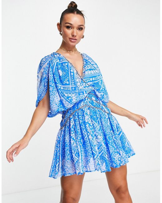 Asos Design blouson mini dress with chain strapping detail in blue floral-