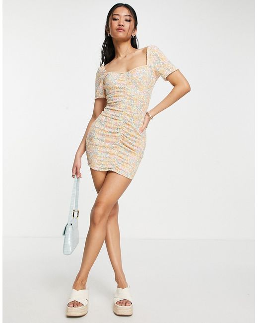 Asos Design textured ruched mini dress with short sleeves in pastel floral print-