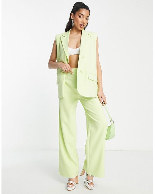 The Frolic relaxed tailored pants with split hem in soft lime-