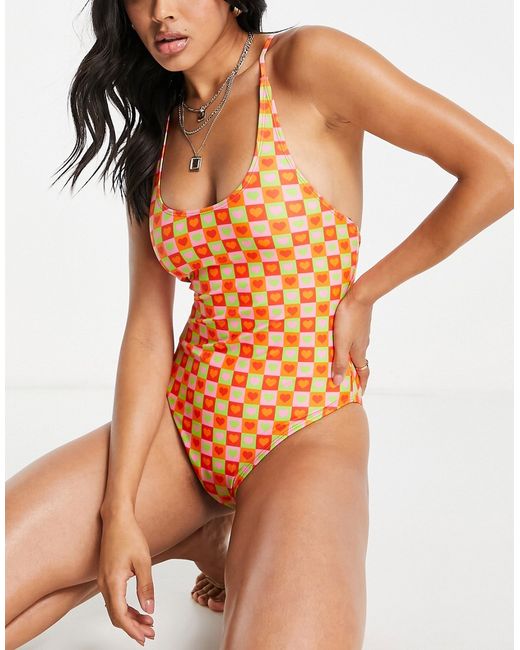 Urban Threads cross back swimsuit in orange and tile heart print