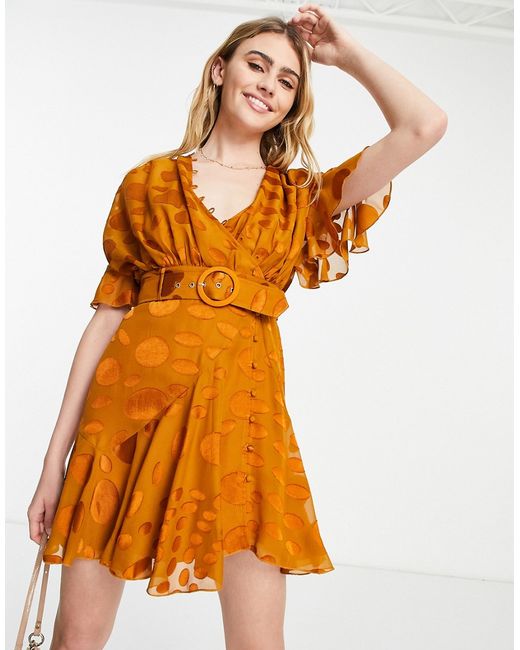 Asos Design mini dress with rouleaux details and belt in rust warped dot-