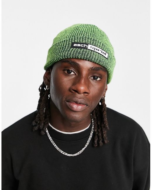 Asos Design fisherman beanie in neon and black twist with rubber patch-