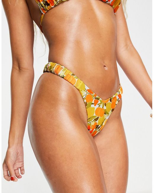 Kulani Kinis x Hannah Meloche retro high leg bikini bottom in multi lemon oranges print