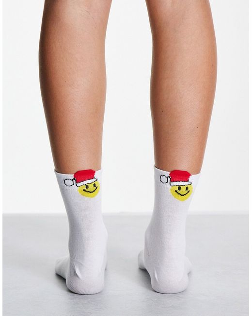 Asos Design Christmas ankle socks with happy Santa in