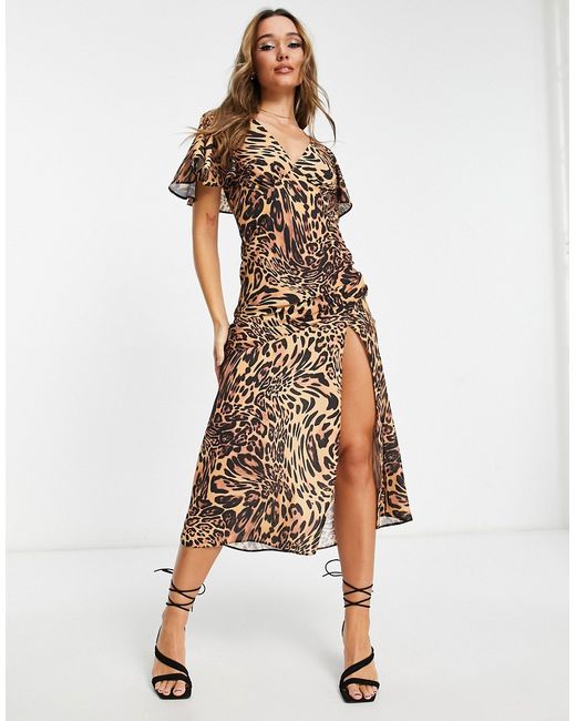 Asos Design fluted sleeve maxi dress with cut out back in animal print-