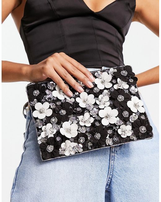 Asos Design clutch with 3D flowers in