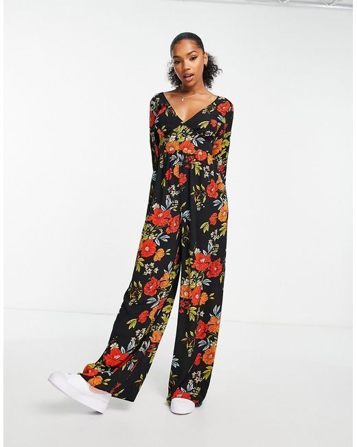 Asos Design bubble crepe button back long sleeve jumpsuit in floral print-
