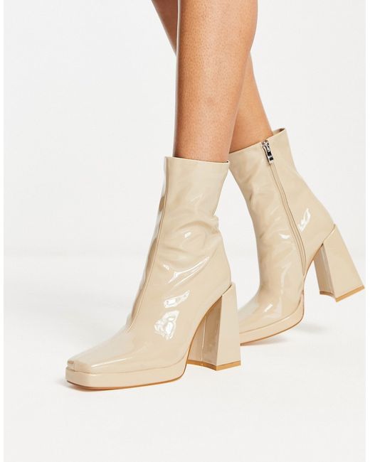 Raid Vista heeled sock boots in ecru vinyl-