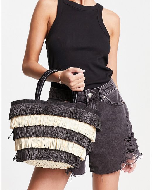 Asos Design tote bag in straw with black and natural fringe-