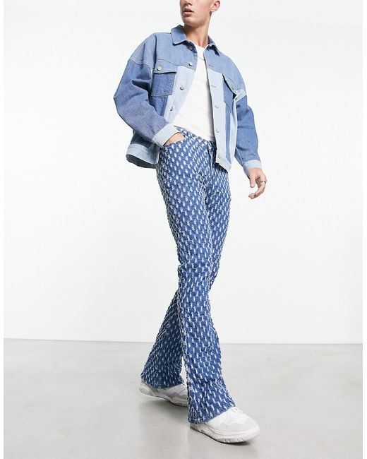 Asos Design flare jeans with all over distressing in