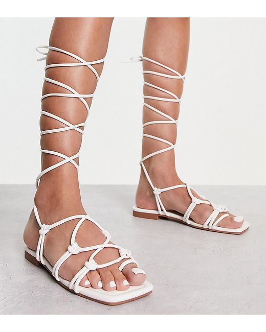 Raid Wide Fit Exclusive strappy ghillie tie sandals in off