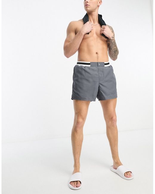 Asos Design swim shorts in mid length with smart styling charcoal-