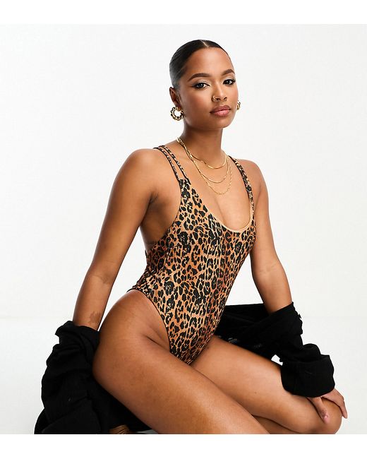 ASOS Petite DESIGN Petite ribbed lattice strap swimsuit with high leg in leopard print-