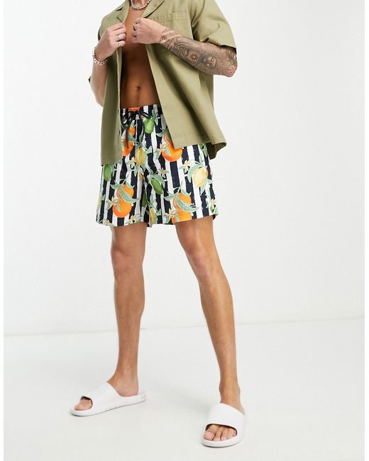 Chelsea Peers swim shorts in and white fruit print