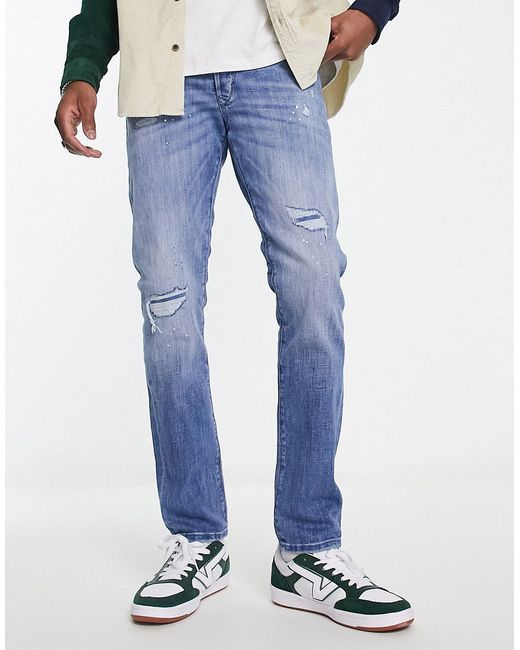 Jack & Jones Intelligence Glenn slim fit jeans with pant platter rip and repair in light wash-