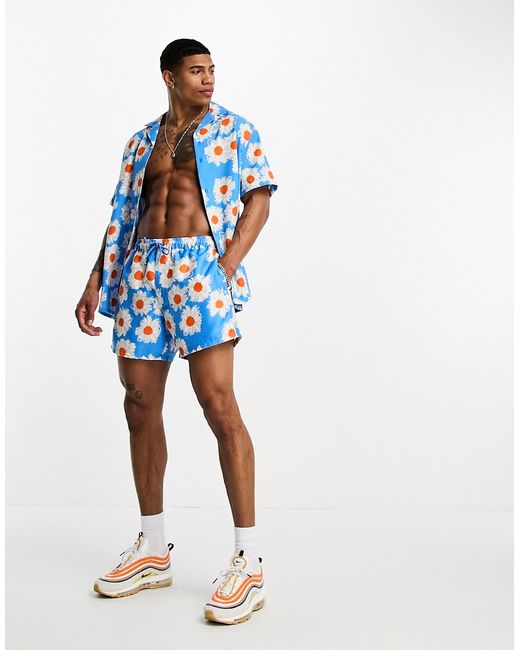 Asos Design swim shorts in short length daisy print part of a set-