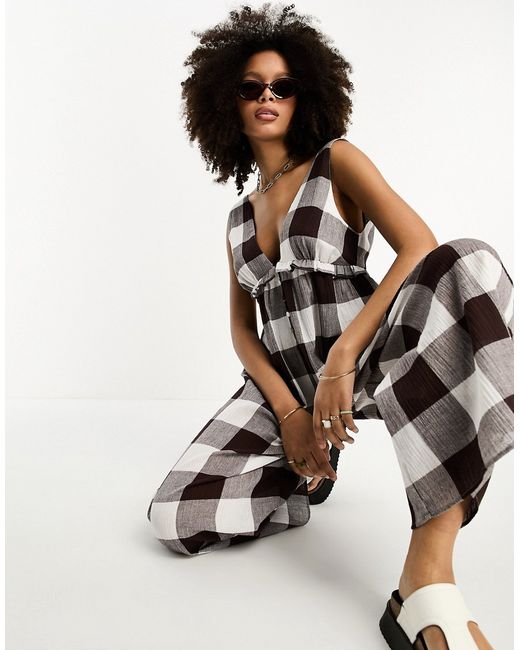 Asos Design tiered crinkle frill jumpsuit in gingham