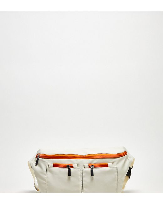 Public Desire Ethan pocket detail tech fanny pack in stone and orange-