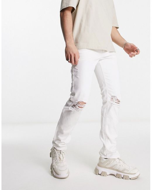 Asos Design slim jeans with knee rips in