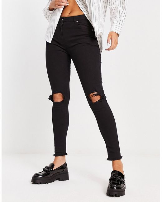 Parisian skinny jeans with ripped knee in
