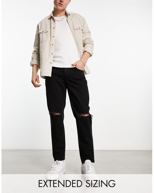 Asos Design classic rigid jeans in wash with knee rips