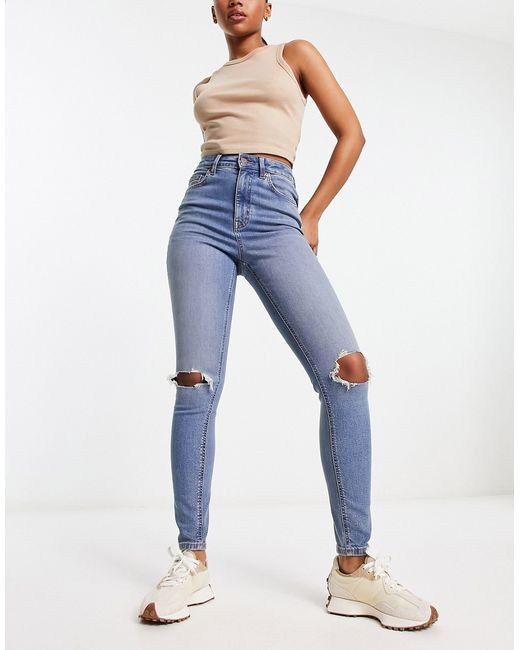 Asos Design ultimate skinny jean in mid with knee rips