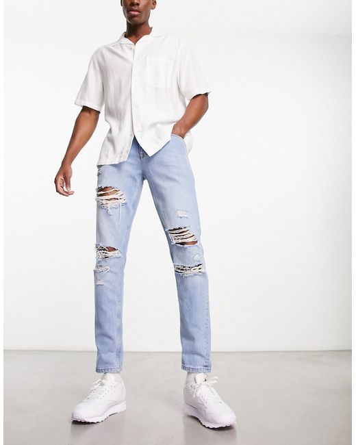 Asos Design slim jeans with rips in light wash