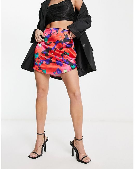 Asos Design satin mini skirt with curved hem in bold floral print