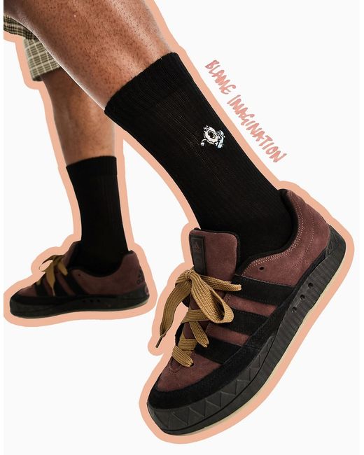 Asos Design sports socks in with donut embroidery