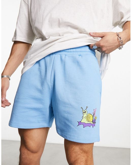 Asos Design oversized shorts in with cartoon print