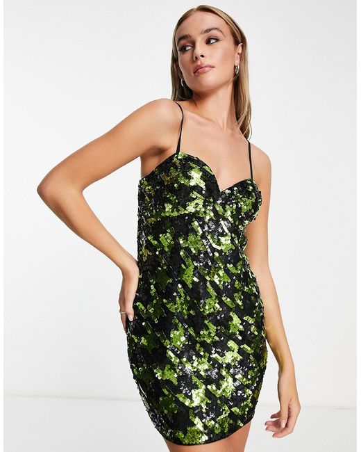 Miss Selfridge Premium festival sequin dogtooth mini dress in black and green-