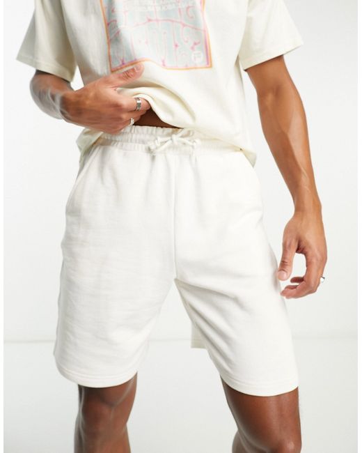 Fila jersey shorts with back pocket print in ecru-