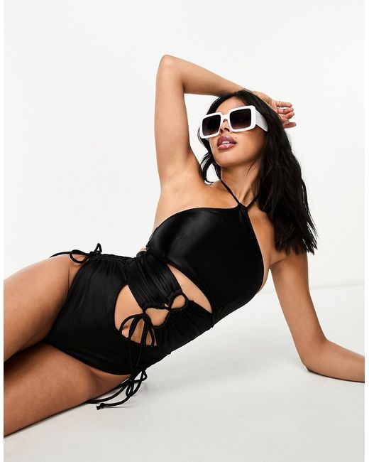 Luxe Palm cut out strappy halterneck swimsuit in